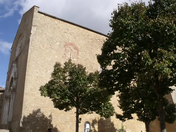 Monticchiello: the façade of the parish church of Saints Leonard and Christopher